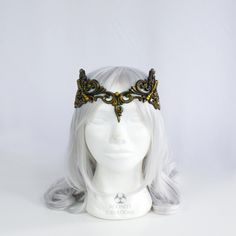 This beautiful sculpted latex circlet looks like metal while being comfortable, lightweight and completely flexible. Consisting of baroque inspired ornate filigree this headpiece can be worn in two ways to suit your unique style. It ties in the back allowing it to fit any head size. Please note this piece is made in England and contains latex. Fantasy Gold Costume Hats And Headpieces For Masquerade, Gold Structured Crown Headpiece For Festival, Gold Adjustable Headpiece With Structured Crown, Elegant Tall Crown Headpieces For Costume Party, Fantasy Gold Headpiece For Costume, Gold Fantasy Headpiece With Structured Crown, Gold Structured Crown Fantasy Headpiece, Adjustable Gold Crown Headband, Gold Fantasy Crown For Festival