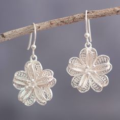 Cool silver shines in these feminine flower earrings from Peru's Alfredo Inga. The artisan crafts the dangle earrings from sterling silver in the time-honored technique of filigree. Delicate Silver Nickel-free Flower Earrings, Delicate Silver Flower Earrings Nickel-free, Silver Delicate Nickel-free Flower Earrings, Delicate Silver Flower Earrings Nickel Free, Delicate Sterling Silver Flower Earrings For Jewelry Making, Filigree Flower Earrings, Silver Pierced Flower Earrings For Gift, Filigree Flower Drop Earrings, Silver Filigree Dangle Flower Earrings