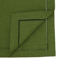 two pieces of green fabric folded on top of each other with black and white stitching