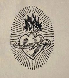 a drawing of a heart with flames in the middle and a cup on it's side