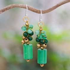 Different shapes and shades of gorgeous green quartz beads are skillfully combined with brass beads in this pair of precious dangle earrings to create a mesmerizing effect that will catch the eye of anyone in the room. Thailand's Nareerat adds golden metallic thread accents for a dash of glamor and completes her design with a brass ring and sterling silver hooks. Green Aventurine Dangle Earrings, Green Aventurine Drop Earrings, Green Brass Earrings With Round Beads, Green Jade Earrings With Gemstone Beads, Green Beaded Dangle Earrings With Natural Stones, Green Jade Gemstone Bead Earrings, Green Gemstone Bead Drop Earrings, Green Jade Dangle Beaded Earrings, Green Jade Beaded Drop Earrings