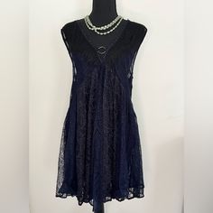 Cute Black And Blue Lace Dress With Deep V Front And Back. The Skirt Is Lined But The Bust Is Not, Pair With A Cami Or Lace Bra. Cotton/Nylon Blend Euc Never Worn Approximate Measurements Length- 32” Put To Pit- 18” Casual V-neck Mini Dress With Lace Trim, Sheer Lace V-neck Mini Dress, Bohemian Lace Mini Dress For Night Out, Lace Trim V-neck Mini Dress, Bohemian Sleeveless Lace Dress For Party, Bohemian Sleeveless Lace Party Dress, Blue Lace Dress, Lace Blue Dress, Free People Dress