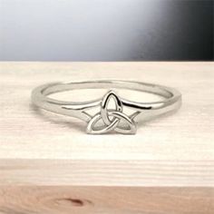 "Handcast 925 Sterling Silver Irish Celtic Trinity/Triquetra Knot Ring     The Triquetra originally meant \"triangle\" and was used to refer to various three-cornered shapes. The design is used as a religious symbol adapted from ancient Celtic images by Christianity. It is similar to Odin's symbol, the valknut.                                        This gorgeous ring was handcast by me in my studio from solid stamped nickle free 925 Sterling Silver. The ring measures approx. 0.24\" tall, tapering down to 0.08\" in back Weight approx. 2 grams depending on ring size. The ring can be custom sized from size 4 up to size 10 for no additional charge. Jewelry Gift Box Handling time approx. 5 days Domestic Standard shipping $4 Domestic Priority Mail shipping $8 Domestic Express Mail shipping $23 Odin Symbol, Celtic Images, Tree Of Life Ring, Celtic Weave, Celtic Dragon, Spiral Ring, Gorgeous Ring, Religious Symbols, Irish Celtic