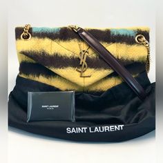 Like New Condition, Comes With Dust Bag And Authenticity Card. Saint Laurent Small Puffer Bag In Tie Dye Fabric And Lambskin Monogram Bag, Decorated With Metal Ysl Initials And Featuring A Leather And Chain Crossbody Strap That Can Be Worn Doubled As A Shoulder Strap. 45% Wool 25% Lambkin 30% Brass Dimensions: 29 X 17 X 11 Cm/ 11.4 X 6.6 X 4.3 Inches Strap Drop: 52cm / 20.4 Inches, Doubled 28 / 11 Inches Cm Bronze-Toned Metal Hardware Magnetic Snap Closure Interior: One Main Compartment, One Zip Pocket Grosgrain Lining Style Id 57747625d177071 Luxury Yellow Shopping Bag, Designer Yellow Leather Bags, Designer Yellow Rectangular Shoulder Bag, Luxury Yellow Shoulder Bag For Shopping, Designer Yellow Pouch Bag, Designer Yellow Bags For Everyday Use, Luxury Yellow Crossbody Bag, Designer Yellow Top Handle Shoulder Bag, Luxury Yellow Crossbody Shoulder Bag