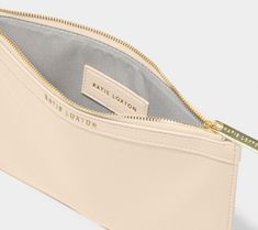 Introducing our brand-new Cleo Pouch, the perfect accessory to add to your new season wardrobe! Crafted with luxe vegan leather, this pouch boasts a sleek design with a gold Katie Loxton logo and a secure zip fastening. Incredibly versatile, this pouch can be used for organization to store makeup and beauty products, or as a chic clutch for a night out! This design exudes sophistication and luxury, adding a touch of glamour to any outfit. Luxury Rectangular Pouch With Gold-tone Hardware, Katie Loxton, New Season, Sleek Design, Beauty Products, Vegan Leather, Night Out, Pouch, Sleek