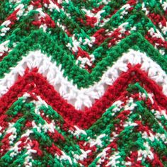 the crocheted afghan is red, white and green