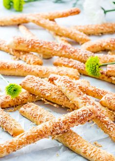 some bread sticks are lined up and ready to be eaten