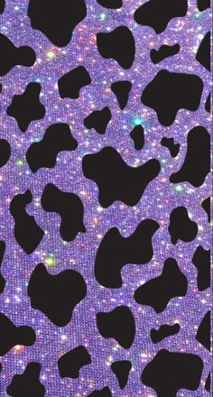 a purple and black leopard print pattern with glitters on it's back side