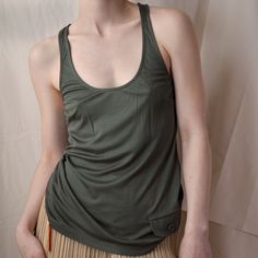 Dior FW 2005 Army Green Tank 120.00 Icarus Vintage Sporty Tops With Pockets For Summer, Green Racerback Vest Top, Casual Green Racerback Vest, Green Everyday Tank Top, Everyday Green Tank Top, Green Everyday Tank Top With Tank Straps, Green Racerback Vest For Summer, Sporty Green Tank Top, Green Sporty Tank Top For Everyday