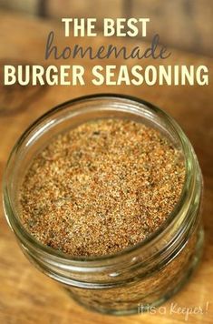 the best homemade burger seasoning recipe in a glass jar on top of a wooden table