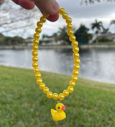 Duck bracelet with yellow beads. Cheap Handmade Yellow Beaded Bracelets, Cheap Cute Yellow Beaded Bracelets, Yellow Beaded Bracelet With Colorful Beads For Gift, Yellow Beaded Bracelets With Colorful Beads As A Gift, Yellow Beaded Bracelet With Multicolor Beads As Gift, Yellow Beaded Bracelet As A Gift, Yellow Beaded Bracelets As Gift, Yellow Beaded Stretch Bracelet As Gift, Yellow Beaded Bracelet Perfect For Gifts