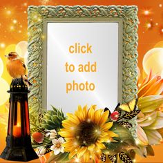 a photo frame with sunflowers and a bird sitting on it, next to a lantern