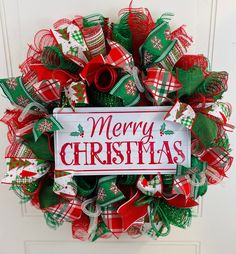 a christmas wreath hanging on the front door