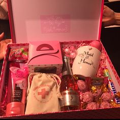 a pink box filled with lots of different items