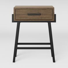 a small wooden table with two drawers on one side and an open drawer on the other