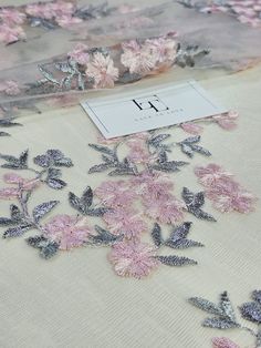 "Grey pink embroidered tulle lace fabric, bridal wedding lace, evening dress lace, by the yard. White delicate tulle fabric with grey/pink flower embroidery. Quantity available. Please \"Add to cart\" to see available quantity. Both sides scalloped. Width: 135 cm/53.1 inches Item number: LK87002 Made in Europe www.LaceToLove.com Price is set for one meter/yard.  You will receive the fabric in one continuous piece if you purchase more than 1 meter/yard. Actual color may vary greatly form the colo Elegant Pink Fabric With 3d Embroidery, Pink Embroidered Organza Fabric With Lace Work, Elegant Pink Embroidered Fabric With Lace Work, Elegant Pink Embroidered Fabric With Floral Design, Elegant Embroidered Pink Lace, Elegant Pink Embroidered Lace, Pink Tulle Fabric With 3d Embroidery For Wedding, Pink Wedding Tulle Fabric With 3d Embroidery, Pink Tulle Fabric With Intricate Embroidery For Wedding