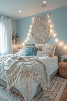 a bedroom with blue walls and lights on the headboard, rugs and bedding