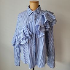 Blue And White Striped Button Shirt With Layered Beautiful Detailing Across The Shirt And Right Arm Sleeve. Never Worn. Perfect Condition. 19" Chest. 25" Length. Us Size Closest To Medium Chic Blue Shirt With Ruffles, Blue Collared Ruffle Top, Arm Sleeve, Button Shirt, Button Up Shirt, Shirt Color, Button Up Shirts, Colorful Shirts, Blue White