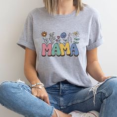 Mama Shirt, Wildflowers Mama Shirt, Mama Shirt, Retro Mom Shirt, Mother's Day Gift, Flower Shirts for Women, Floral New Mom Gift Thank you so much for taking the time to browse my shop. Please feel free to reach out if you have any questions before or after purchasing.  💖 🎨Warning: On products with a print chart in the listing, metallic print colors are printed as matte. We design and cut each graphic out with a soft touch, use matte vinyl and a heat press. The result will last for many washes Trendy Gray Spring Shirt, Summer Letter Print Shirt Gift, Summer Letter Print Shirt For Gift, Summer Letter Print Shirt As Gift, Multicolor T-shirt For Spring Gift, Spring Tops As Gifts, Relaxed Fit Cotton Shirt For Mother's Day, Funny Print Short Sleeve Shirt For Mother's Day, Spring Graphic Print Tops Gift