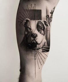 a man's leg with a dog tattoo on it