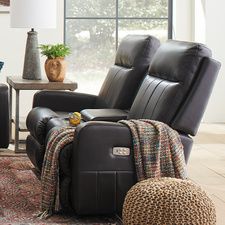 a living room with two recliners and a coffee table