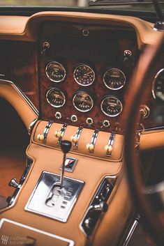 the interior of an old car with gauges and dash boards on it's dashboard