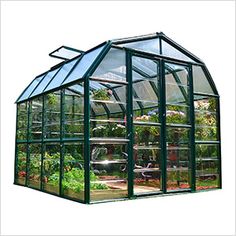 a green house with lots of plants inside