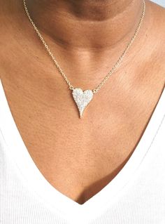 Do you want to feel the sparkle and joy of love? Look no further than the Amara Heart Diamond necklace – your new favorite piece of jewelry! This brilliant necklace features a heart-shaped cubic zirconia with a gorgeous shiny finish. The diamond-like beauty of this necklace is sure to make heads turn! Plus, its rhodium-plated or gold-plated 16" plain chain with a 2" extender provides flexibility should you want to layer it with other necklaces. Experience its beautiful sparkles for yourself and Valentine's Day Party Heart Necklace In Cubic Zirconia, Glamorous Diamond Rhinestone Necklace As Gift, Glamorous Diamond Rhinestone Necklace For Gift, Heart Cut Cubic Zirconia Party Necklace, Heart Cut Cubic Zirconia Necklaces For Party, Heart Cut Cubic Zirconia Party Necklaces, Heart Cut Cubic Zirconia Necklace For Party, Heart Cut Cubic Zirconia Necklace With Heart Charm, Glamorous Diamond White Necklace For Anniversary