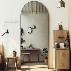 an arch shaped mirror in the corner of a room with two stools and a table