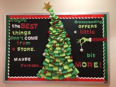 a bulletin board with a christmas tree made out of strips of green paper and ribbon