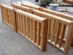 several wooden benches lined up on the sidewalk