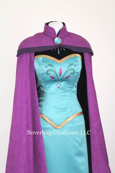 a dress with a cape on top of it