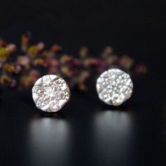 "7 Diamond set in an illusion setting to create a 6 mm round ear studs. These simple earrings are a perfect alternative to bigger solitaire studs. The top will be rhodium plated to provide that solitaire look, in case you don't want it please convo. * Diamond Wt. : 0.48 Cts * Color/Clarity Grade : H-I, Vs-Si * Gold - 14k, 2.1 gms gold (Approx) * Dimension : 6mm x 6mm (approx) If you like this earring, please press \"Pin it\" button on the right of your screen. Find us on Instagram for exquisite Pressure Setting Diamond Earrings, Round Diamond White Cluster Earrings For Gift, Diamond White Cluster Earrings With Sparkling Stones, Round Diamond Cut Cluster Earrings For Gift, Round Cluster Earrings With Sparkling Stones For Anniversary, Round Cluster Earrings With Sparkling Stones For Gift, Anniversary Round Cluster Earrings With Sparkling Stones, Gift Cluster Earrings With Sparkling Stones, Gift Round Diamond White Cluster Earrings