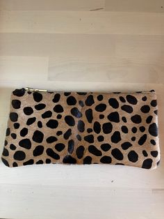 "This  Handmade Leopard Print Leather Makeup Bag with Black Cotton Lining the perfect birthday gift, graduation gift, or Christmas gift for all women. All our leather pouches are made with the highest quality material.  Size:  8 1/2\" x 4 1/2\" Satisfaction Guarantee: We strive to provide elite customer service and satisfaction to our customers! If for any reason you are unhappy with your purchase, please let us know and we will work with you to resolve any issues that you are having. Questions? Rectangular Brown Cosmetic Bag, Trendy Portable Pouch For Gifts, Brown Pouch Cosmetic Bag For Gift, Brown Pouch Cosmetic Bag Gift, Trendy Portable Pouch For Gift, Chic Rectangular Wallets For Gifts, Trendy Brown Clutch For Travel, Chic Brown Pouch Cosmetic Bag, Trendy Brown Zipper Pouch