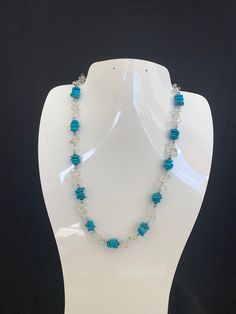 Cute, Southwestern, and versatile beaded Sleeping Beauty Turquoise necklace that is handcrafted by me! This necklace is lightweight and comfortable, making it ideal for everyday wear. It adds a pop of color and a Southwestern vibe to your outfit. You can pair this cute and simple Turquoise necklace with anything. The necklace consists of Sleeping Beauty Turquoise & clear crystal gemstones accented with blue Swarovski crystals. The turquoise is genuine Sleeping Beauty Turquoise mined from Arizona Southwestern Style Blue Necklace For Beach, Blue Southwestern Style Beach Necklace, Southwestern Blue Beach Necklace, Southwestern Style Blue Beach Necklace, Adjustable Turquoise Crystal Necklaces With Gemstone Beads, Artisan Blue Adjustable Crystal Necklaces, Artisan Adjustable Turquoise Crystal Necklace, Sleeping Beauty Turquoise, Turquoise Beads