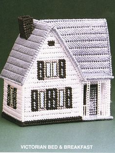 a crocheted doll house is shown with the words victorian bed and breakfast on it