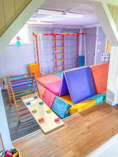 an indoor play area with soft foam blocks and ladders