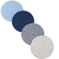 four circular rugs in various colors and sizes