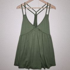 Green Strappy Racerback Flowy Tank New Without Tags. No Brand. Size: Xl Summer Beach Tank Top With Cross Back, Solid Strappy Tank Top For Spring, Casual Summer Tank Top With Strappy Back, Chic Strappy Back Tank Top For Beach, Chic Cross Back Tank Top For Summer, Sleeveless Tank Top With Crisscross Straps For Vacation, Summer Tank Top With Strappy Back, Beach Tops With Crisscross Straps, Beach Tops With Crisscross Straps And Cross Back