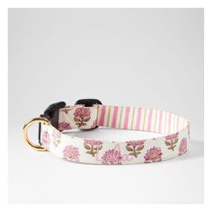 a dog collar with pink flowers and stripes