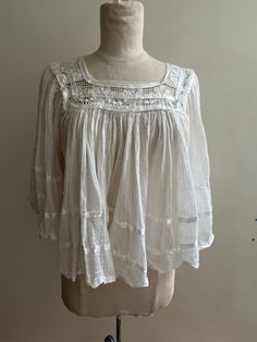 Great condition vintage womens below waist sheer Mexican top with lace and ribbon detail. Summer Cotton Lace Blouse, Summer Cotton Lace Top Blouse, Spring Tops With Cotton Lace Patchwork, Spring Lace Patchwork Cotton Tops, Fitted Feminine Cotton Lace Top, Chic Summer Cotton Lace Top, White Cropped Lace Top With Lace Trim, White Summer Blouse For Gatherings, Summer White Blouse For Gatherings