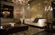 a living room filled with furniture and a chandelier