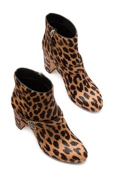 Complete your look with the lively, energetic style of an animal-spotted calf-hair boot lifted by a block heel. 3 1/4" heel; 4 1/4" shaft Side zip closure Genuine calf-hair (Vietnam) upper/textile and leather lining/leather sole Imported Chic High Heel Leopard Print Boots, Chic Leopard Print High Heel Boots, Calf Hair Ankle Boots For Fall, Chic Calf Hair Boots With Round Toe, Chic Leopard Print Leather Boots, Calf Hair, Kate Spade New York, Bootie, Side Zip