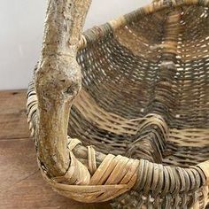 a wicker basket sitting on top of a wooden table