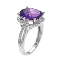 Designed with a cushion-cut genuine amethyst center stone encompassed with lab-created white sapphires, this halo ring is sure to garner compliments. RING DETAILS Width: 0.51 in. Metal: sterling silver Plating: rhodium Finish: polished Packaging: boxed STONE DETAILS Stone type: amethyst, lab-created white sapphire Total weight: 4 3/4 ct. Center stone weight: 4 1/2 ct. Center stone size: 12 mm x 10 mm Shape: cushion cut, round Setting: prong Gemstones may have been treated to enhance their appear Cushion Cut Wedding Rings With Gemstone Accents, Formal Amethyst Cushion Cut Jewelry, Formal Cushion Cut Amethyst Jewelry, Cushion Cut White Gold Ring With Gemstone Accents, Elegant Cushion Cut Amethyst Ring With Accent Stones, Formal Amethyst Cushion Cut Ring With Accent Stones, Cushion Cut Amethyst Wedding Ring, Elegant Purple Cushion Cut Amethyst Ring, Elegant Cushion Cut Amethyst Ring