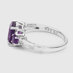 "Real Amethyst Ring / 3-Stone Amethyst Silver Ring / Natural Amethyst Ring / February Birthstone Ring Olivia Leone Jewelry This focus of this sensational three-stone ring is a richly-colored cushion-cut amethyst set in .925 sterling silver with rhodium plating. Two smaller oval-cut amethysts flank the larger stone, and are framed by a bridged metal section housing a small white topaz. Altogether, this ring has a total gem weight of 2.13 carats. amethyst ring, amethyst silver ring, 3-stone amethy Classic Amethyst Rings With Gemstone Accents, Amethyst Three Stone Promise Ring, Round Amethyst Three Stone Promise Ring, Three Stone Amethyst Jewelry, Round Three-stone Amethyst Promise Ring, Round Three Stone Amethyst Promise Ring, Amethyst Three Stone Round Ring, Oval Amethyst Three-stone Jewelry, Adjustable Amethyst Ring With Gemstone Accents