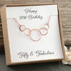 "A beautiful necklace with five Rose Gold circle links. A great way to celebrate that fabulous milestone of 5 amazing decades. This comes in a gift box with a card that reads \"Happy 50th Birthday\" \"Fifty & Fabulous\" The standard chain is a sturdy 18\" flat cable chain. 16\" and 20\" are also available. Also available is the same necklace in Sterling Silver or Yellow Gold The Rose Gold circles are Rose Gold Plated over Sterling Silver with a Rose Gold-Filled chain. The Yellow Gold circles Rose Gold Jewelry Birthday Gift, 50th Birthday Rose Gold, Rose Gold Circle, Happy 50th Birthday, Happy 50th, Compass Necklace, Gold Circle, Silver Circle, 50th Birthday Gifts