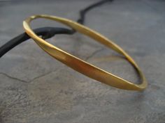 gold oval bangle by ElfiRoose Unique Hand Forged Gold Bangle, Hammered Yellow Gold Brass Bangle, Hand Forged Yellow Gold Bangle, Gold Minimalist Hand Forged Bangle, Minimalist Hand Forged Gold Bangle, Golden Bangles, Oval Bangle, Gold Bracelets Stacked, Bangle Bracelet Gold