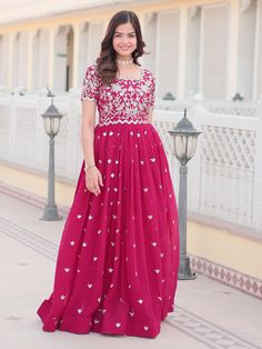 Embrace the vibrant elegance of this rani pink georgette gown, exquisitely embellished with dazzling sequin embroidery work. Designed to make you stand out, this gown is perfect for sangeet ceremonies and other grand celebrations. Fully stitched and available in sizes XS to XXL, it ensures a perfect fit for all body types. With a 3.5-meter flair that adds a graceful flow and a gown length of 56 inches, this piece promises a striking and elegant silhouette. Ideal for a variety of occasions such a Engagement Gown, Lehenga Crop Top, Georgette Gown, Lehenga Choli Wedding, Rani Pink, Floral Lehenga, Party Wear Lehenga Choli, Reception Gown, Bollywood Lehenga