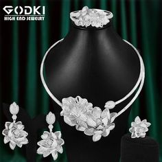 CZ Jewelry- Luxury African Lotus Flower Jewelry Sets For Women Wedding Cubic Zirconia Dubai Bridal Jewelry Set party giftModel Number:1005003564692082Pakcage list1 pair earring ;1pc necklace;1pc ring;1pc bangleMaterial: 18K Gold/White Gold Plated +100% AAA Cubic Zirconia DiamondWearing Occasion: Daliy Wear / Party / Anniversary / WeddingGift for: Girl friend / Wife / Mom / YourselfThis jewelry accord with the eu environmental requirements100% 18K Gold/White Gold Plated Wedding Jewelry Set For Women AAA CZ Imitation Diamond Engagement Jewelry Set Lotus Flower Jewelry, Bridal Jewelry Set, Cz Jewelry, Flower Jewelry, Engagement Jewelry, Wedding Jewelry Sets, Color Ring, Bridal Jewelry Sets, Watch Necklace